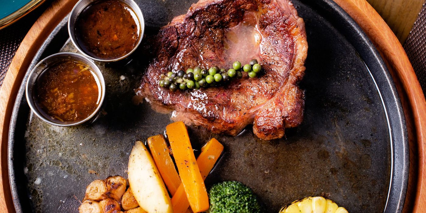 An illustrative steak served on a hot plate
