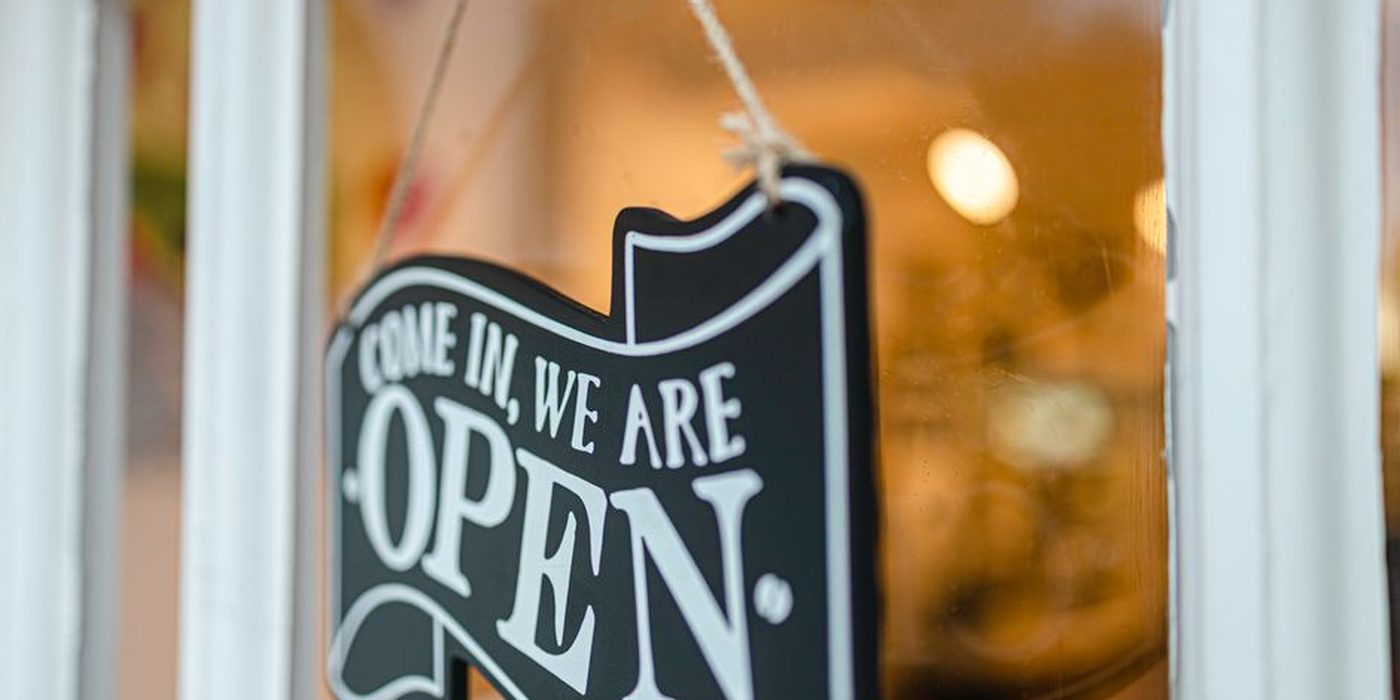 An open sign on a restaurant door