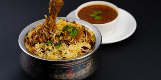 A plate of briyani rice and curry